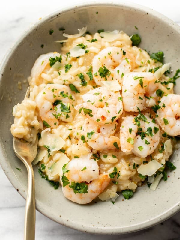 a bowl of lemon and shrimp risotto with a fork