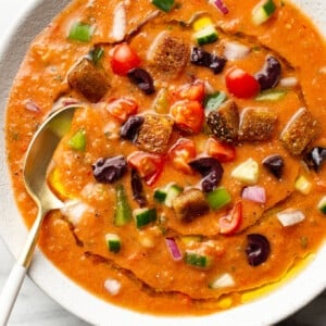 a bowl of gazpacho with a spoon