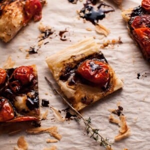 My roasted tomato puff pastry appetizer with a balsamic drizzle is a flavorful vegetarian appetizer that will please a crowd!