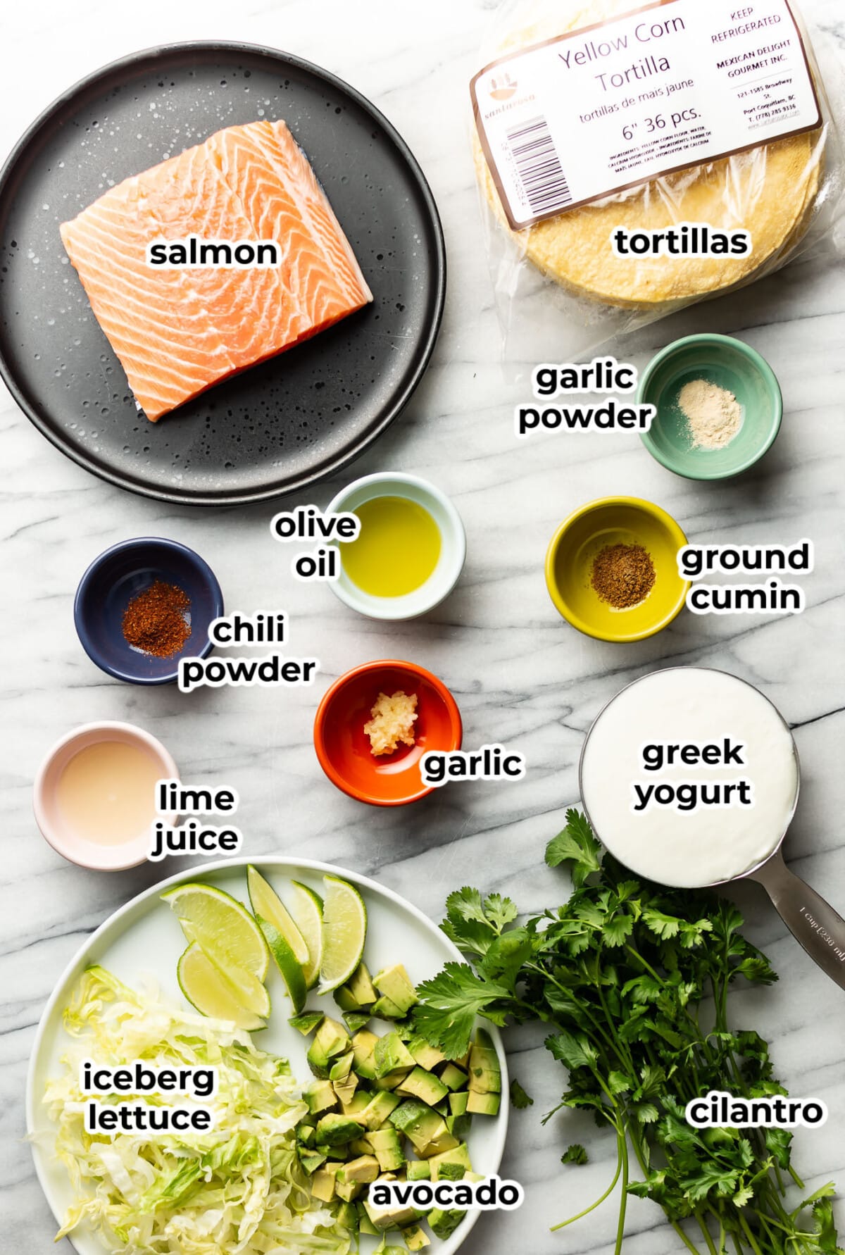 ingredients for baked salmon tacos in prep bowls