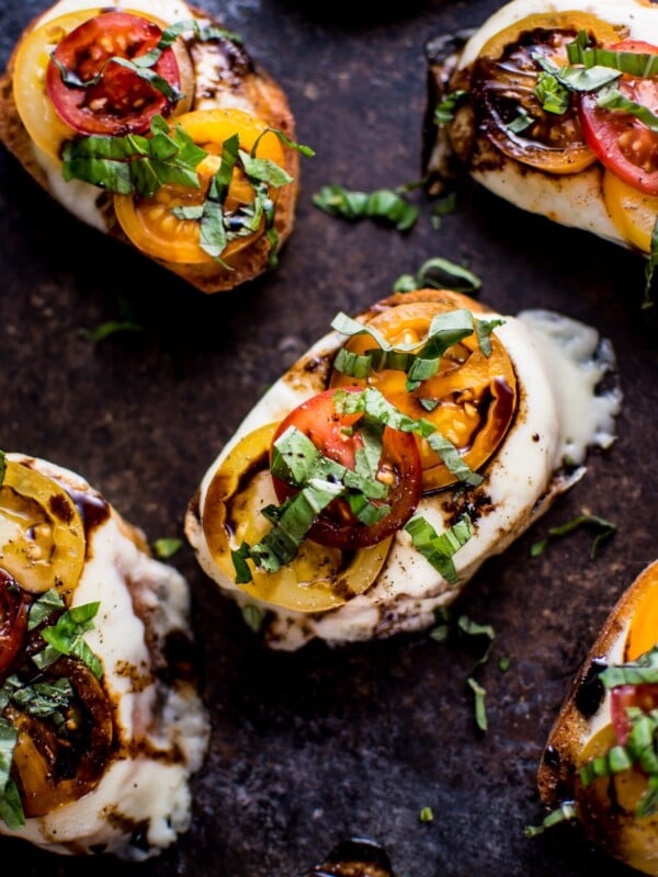 These garlic Caprese crostini melts are a crowd-pleasing appetizer with the classic Caprese flavors of mozzarella, tomatoes, and basil. Finished off with a tangy balsamic drizzle!