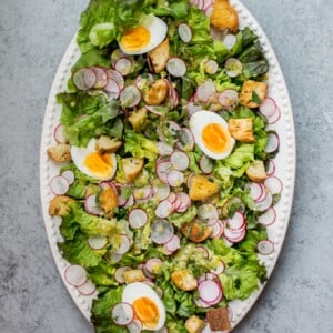 This butter leaf lettuce salad with a lemon dill dressing, garlic croutons, hard-boiled eggs, and radishes is the perfect easy-to-make showstopping summer salad!