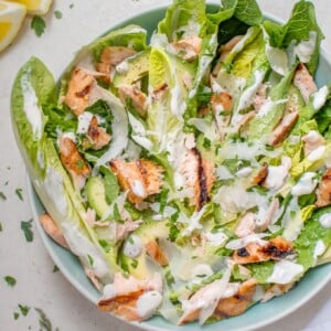 This healthier grilled salmon Caesar salad is lightened up so you can have that fabulous Caesar taste without all the extra calories.