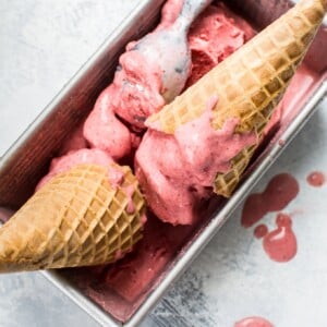 This 2-ingredient vegan strawberry ice cream is made with frozen strawberries, coconut milk, and your food processor in less than 10 minutes!