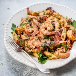 This spicy shrimp pasta with a roasted tomato sauce is easy, fast, and very flavorful. Perfect for a gourmet weeknight dinner or for entertaining.