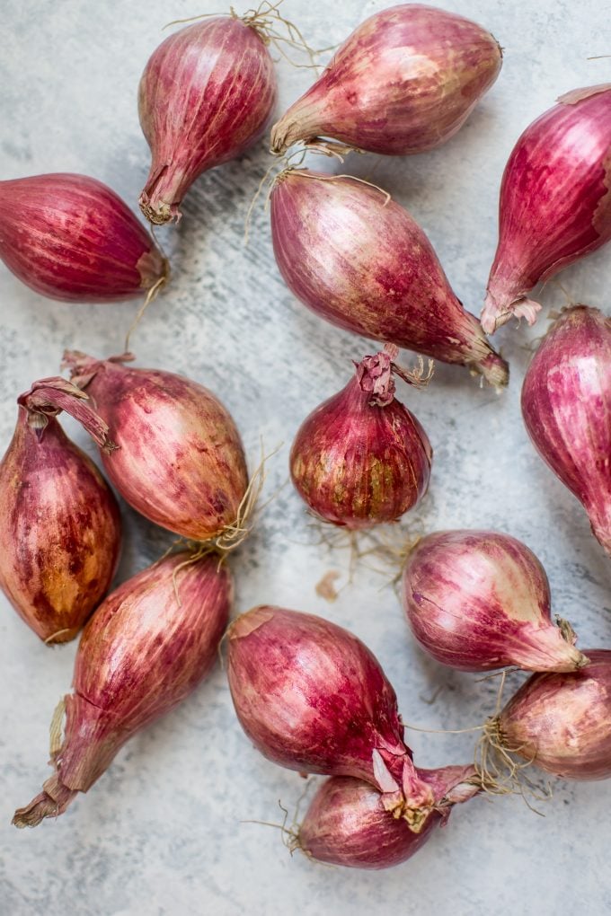 raw unpeeled shallots