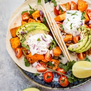This roasted sweet potato tacos recipe makes a delicious, filling, and nutritious meat-free meal! Load 'em up with your favorite toppings and enjoy these all season long.