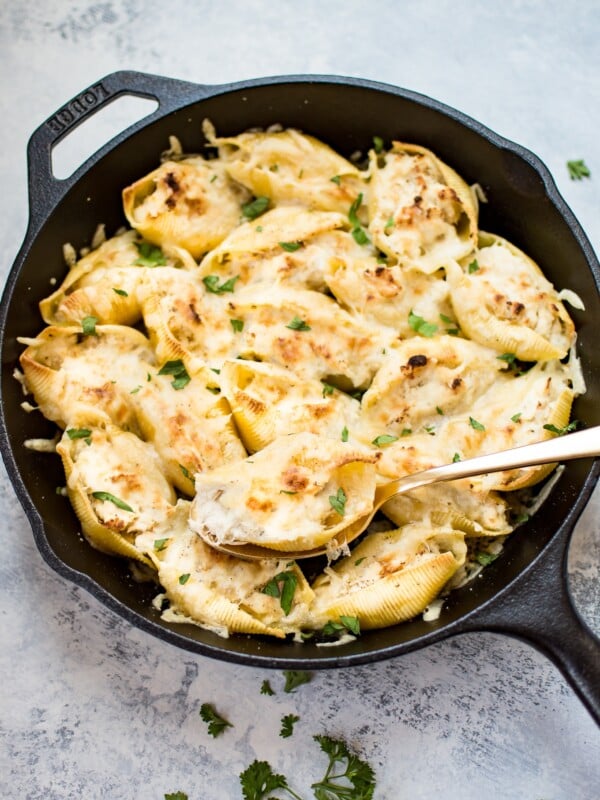 This lemon chicken stuffed shells recipe is easy, cheesy, and delicious. Three different kinds of cheeses and flavorful lemon chicken are baked to melty perfection. This recipe makes an awesome comfort food dinner!