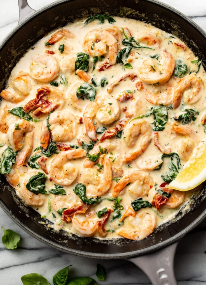 a cast iron skillet with creamy tuscan shrimp
