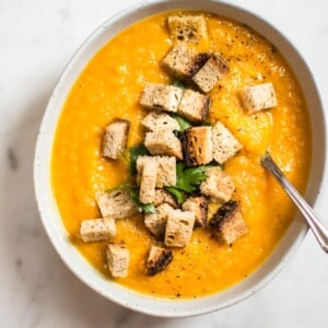 This butternut squash carrot soup recipe is healthy, simple, and has a great depth of flavor from the roasted vegetables!