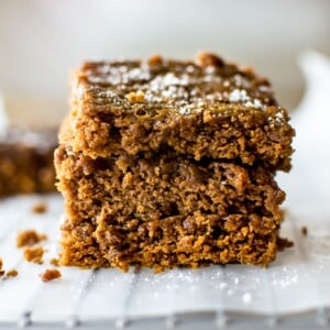 These vegan gingerbread bars are sweet, sticky, easy to make, and wonderfully festive.
