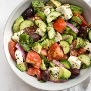 This avocado Greek salad recipe is healthy, fast, and bursting with fresh Mediterranean flavors. This salad is delicious and good for you!