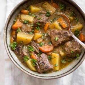 This Instant Pot Irish stew has tender beef, potatoes, carrots, and a delicious traditional Guinness sauce. You will love this simple stew recipe! It's perfect for St. Patrick's Day or any occasion where you want a comforting beef stew recipe. The electric pressure cooker makes this authentic recipe so easy to make.