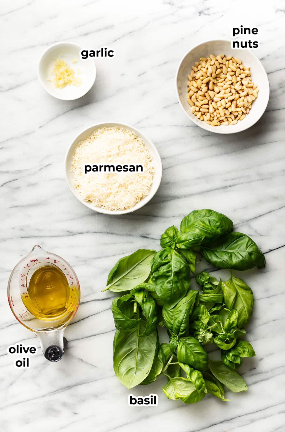 ingredients for homemade pesto in prep bowls