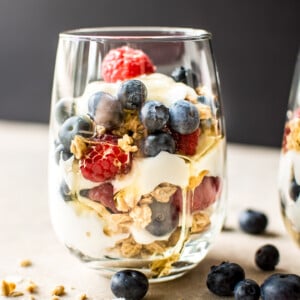 These berry yogurt parfaits are a quick, easy, and delicious breakfast that you can make ahead in mason jars. Perfect for kids or meal prep breakfasts on the go.