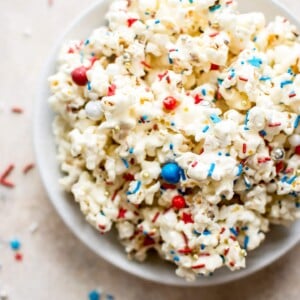 This patriotic marshmallow popcorn is the perfect snack of dessert to feed a crowd on the Fourth of July or Memorial Day! Kids and adults will love it. It's super easy to make.