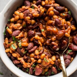 Easy homemade baked beans with bacon - a from scratch recipe that is perfect as a main course, side dish, or cookout/BBQ recipe.