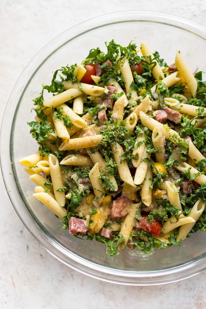 cold kale pasta salad in glass prep bowl