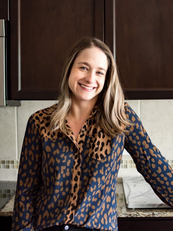 Natasha Bull of the food blog Salt & Lavender standing in her clean kitchen.