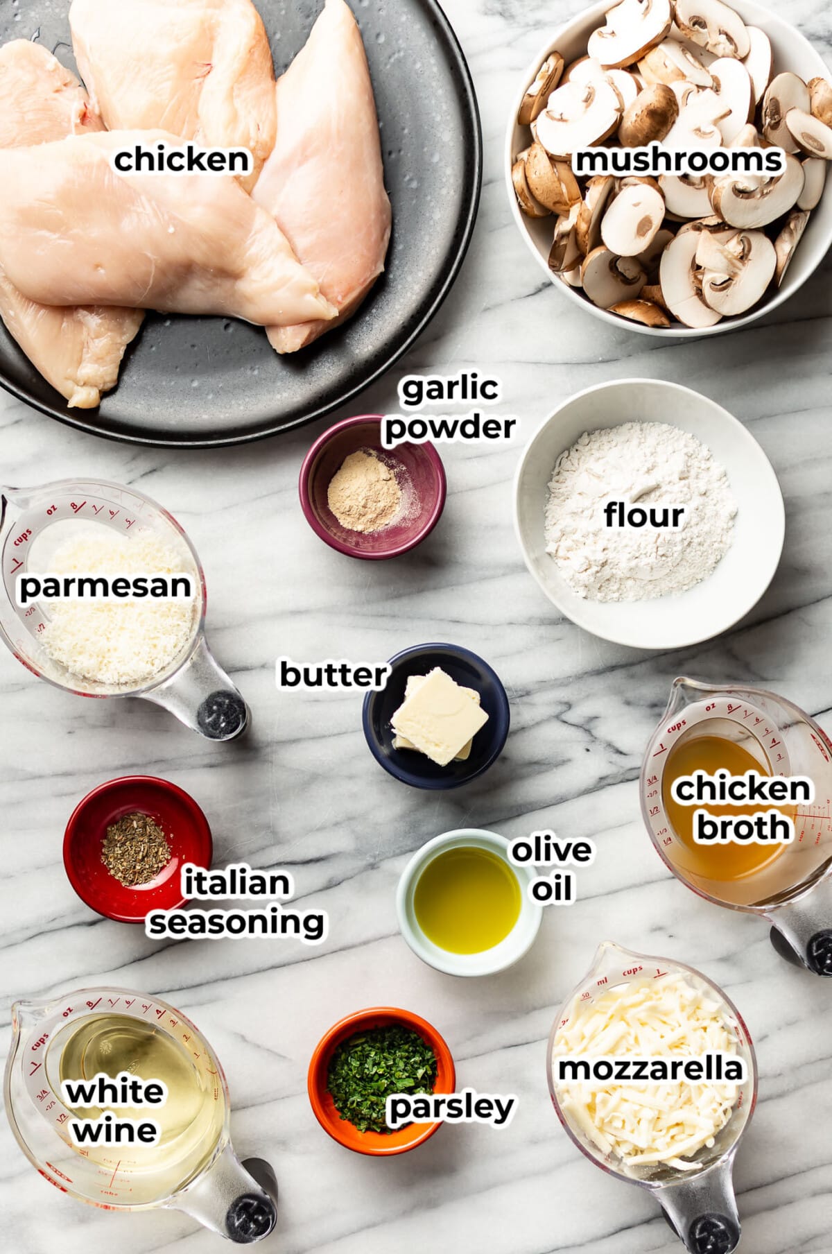 ingredients for mozzarella mushroom white wine chicken in prep bowls