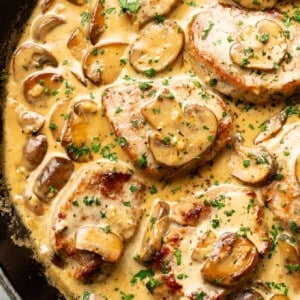 a skillet with creamy mushroom pork tenderloin