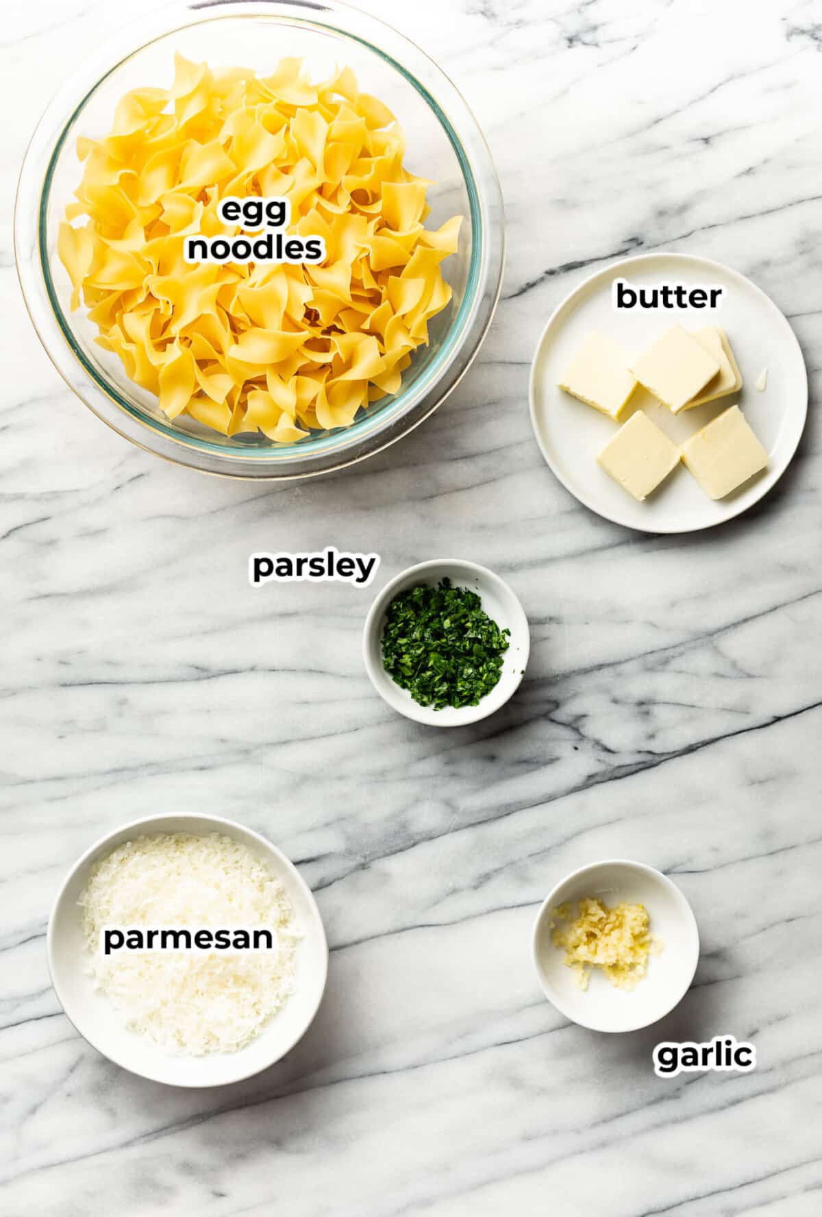 ingredients for garlic butter noodles in prep bowls
