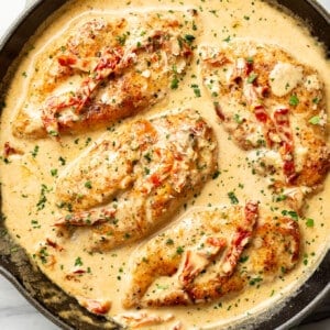 a skillet with creamy cajun chicken