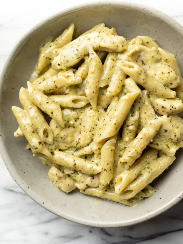 a bowl of creamy chicken pesto pasta