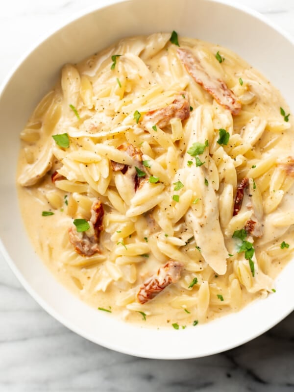 a bowl with cajun chicken orzo
