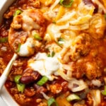 a bowl of turkey chili with a spoon