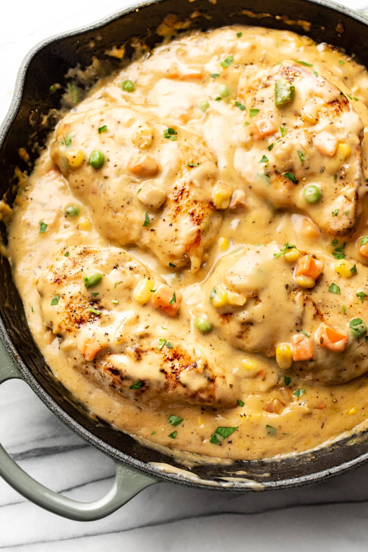 a skillet with cream of chicken soup chicken breasts