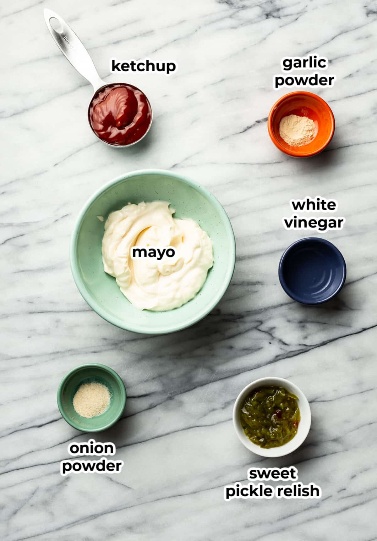 ingredients for burger sauce in prep bowls