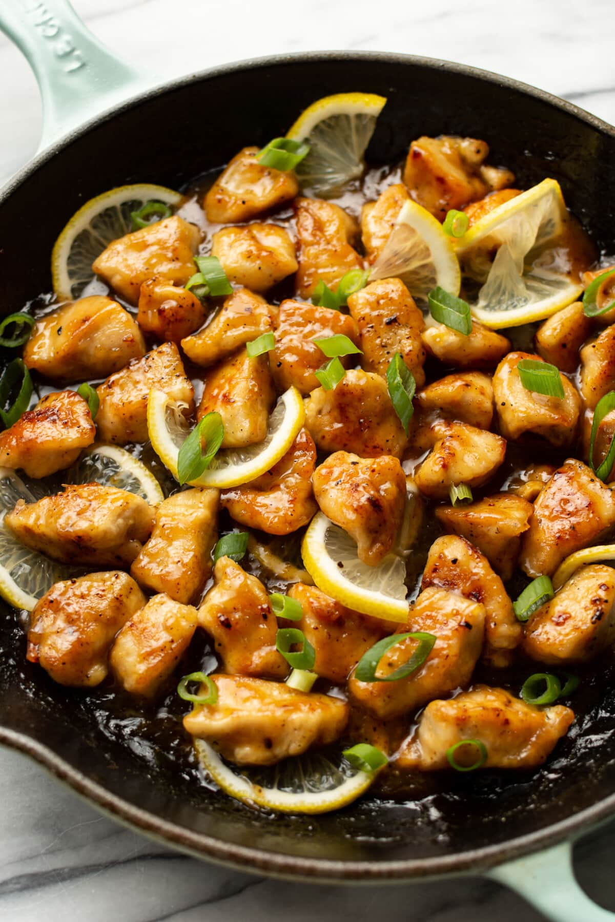 a skillet with chinese lemon chicken