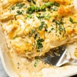 a baking dish with chicken enchiladas