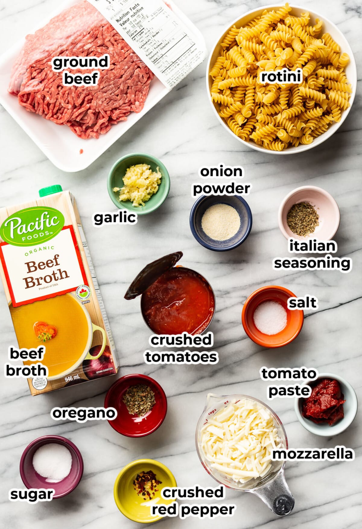 ingredients for one pot rotini pasta in prep bowls