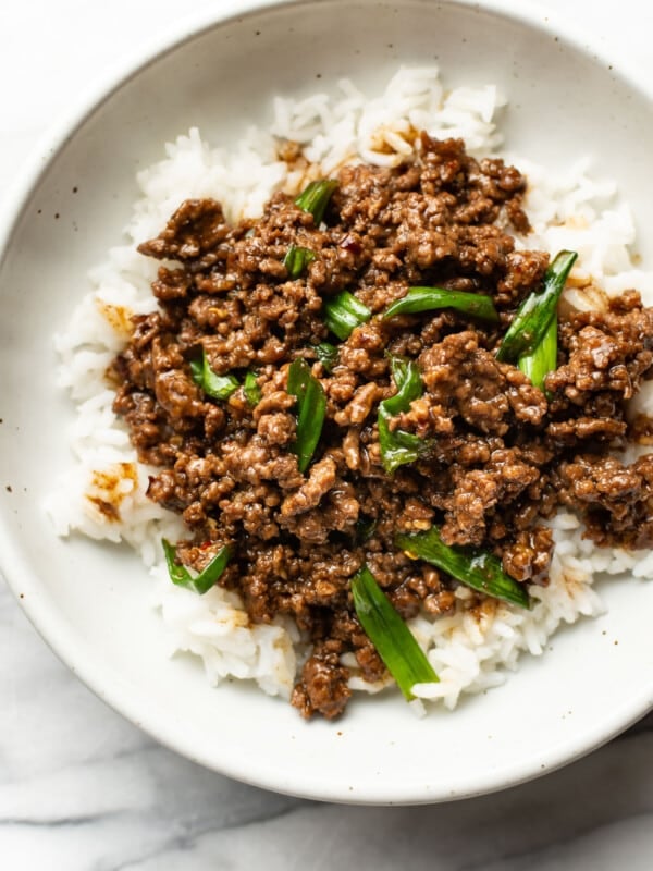 a bowl of mongolian ground beef over rice