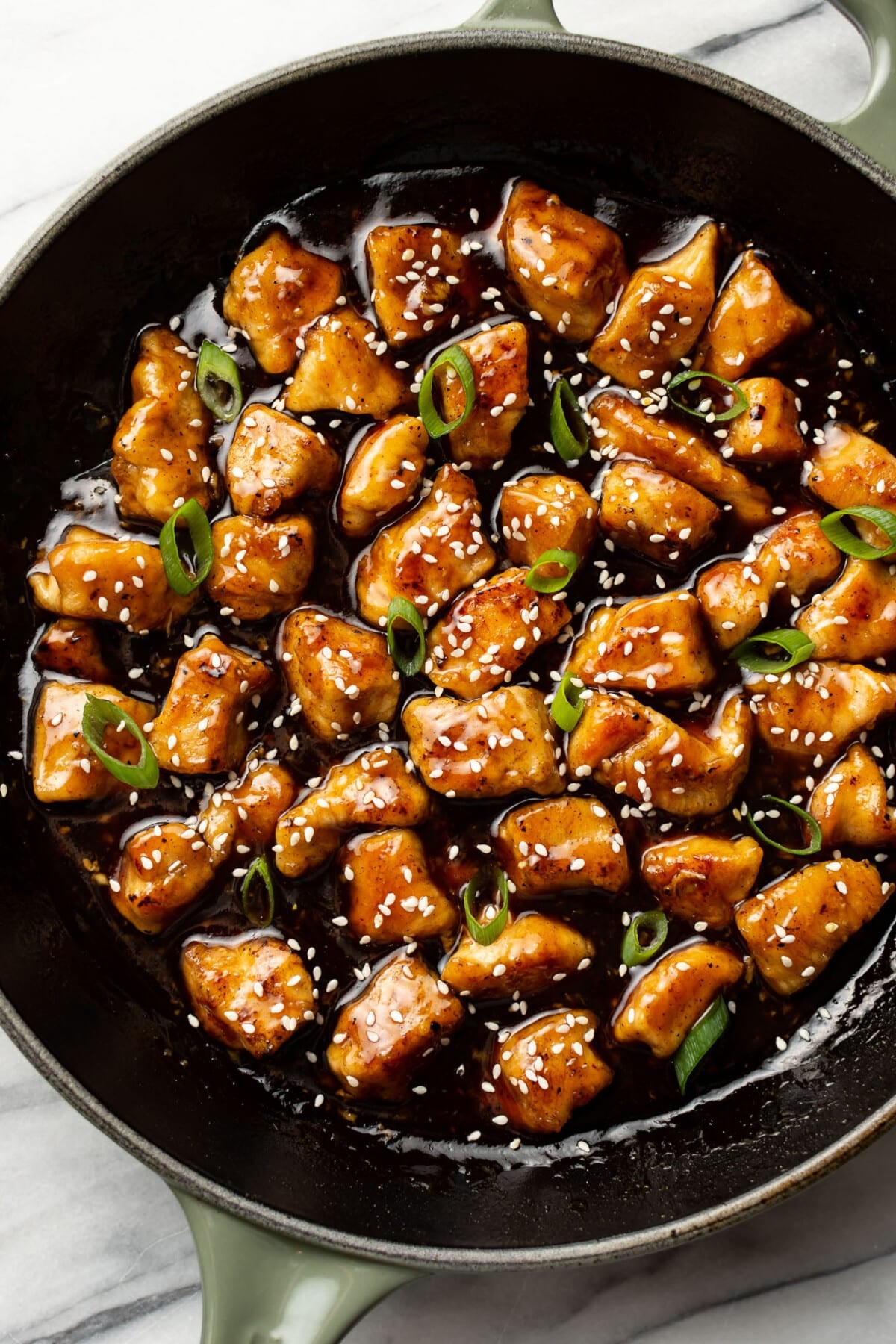a skillet with homemade sesame chicken