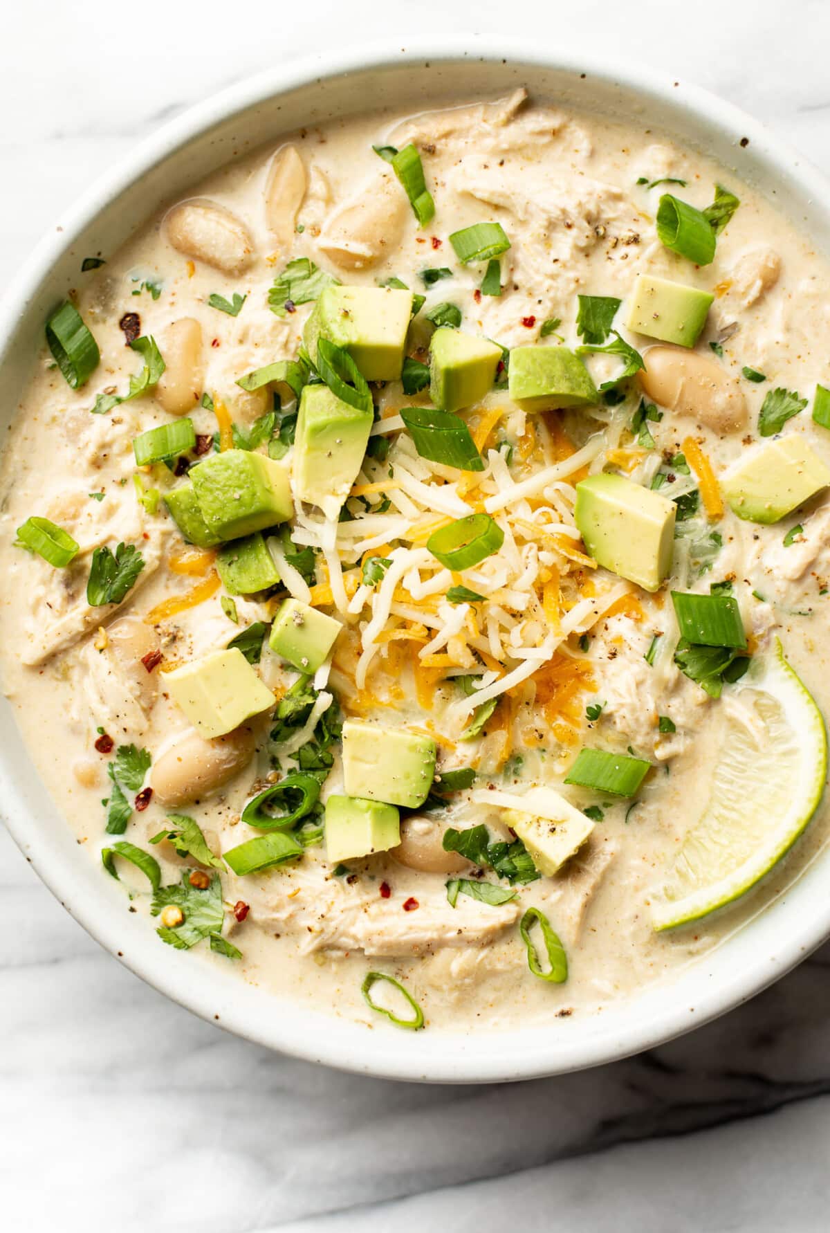 a bowl of slow cooker white chicken chili