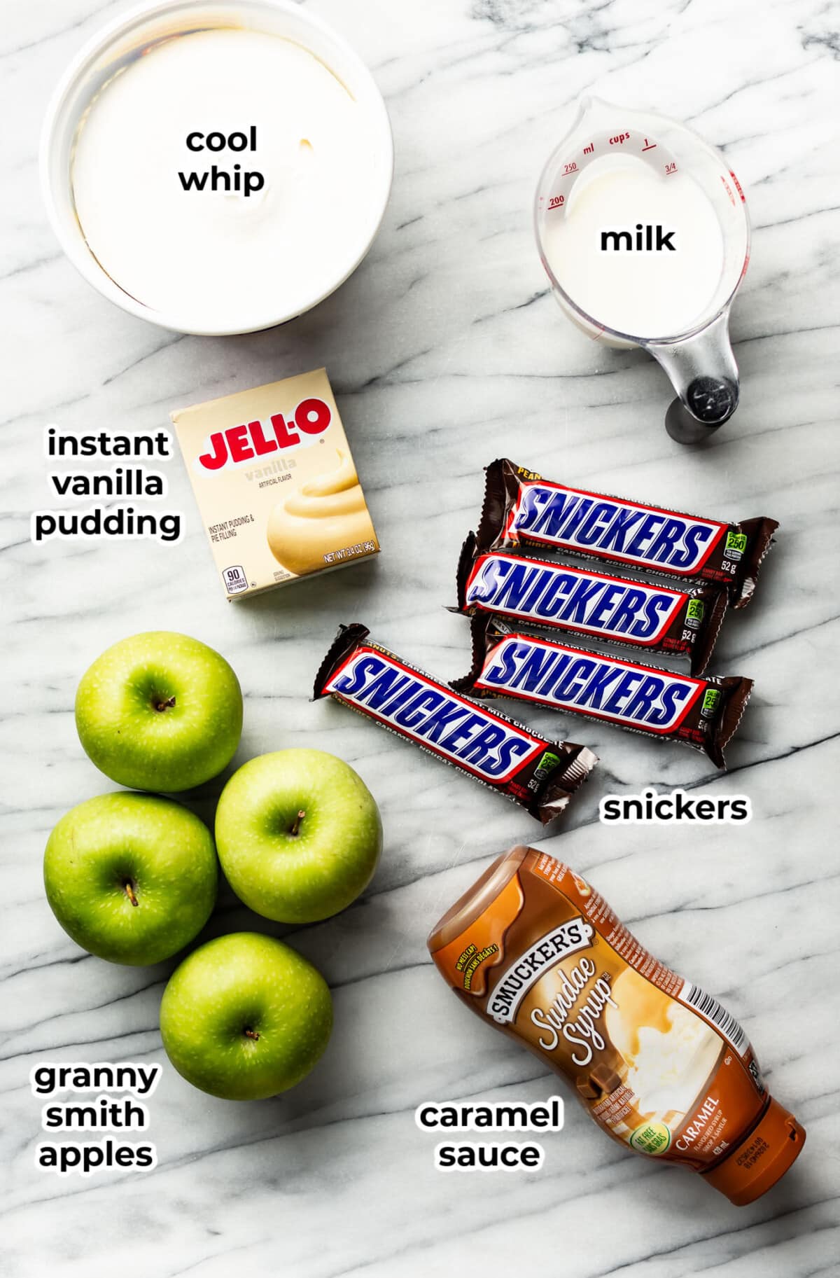 ingredients for snickers salad in prep bowls