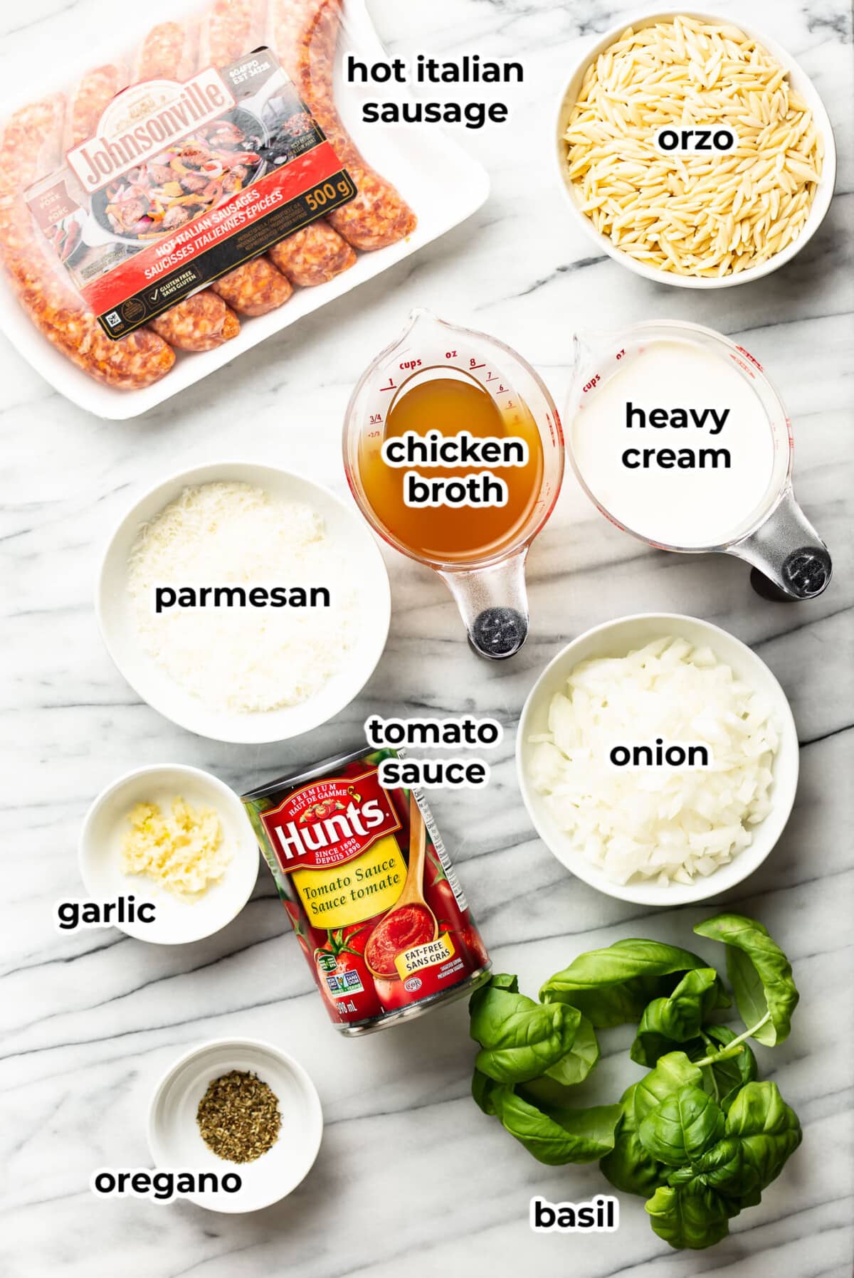 ingredients for spicy italian sausage orzo in prep bowls