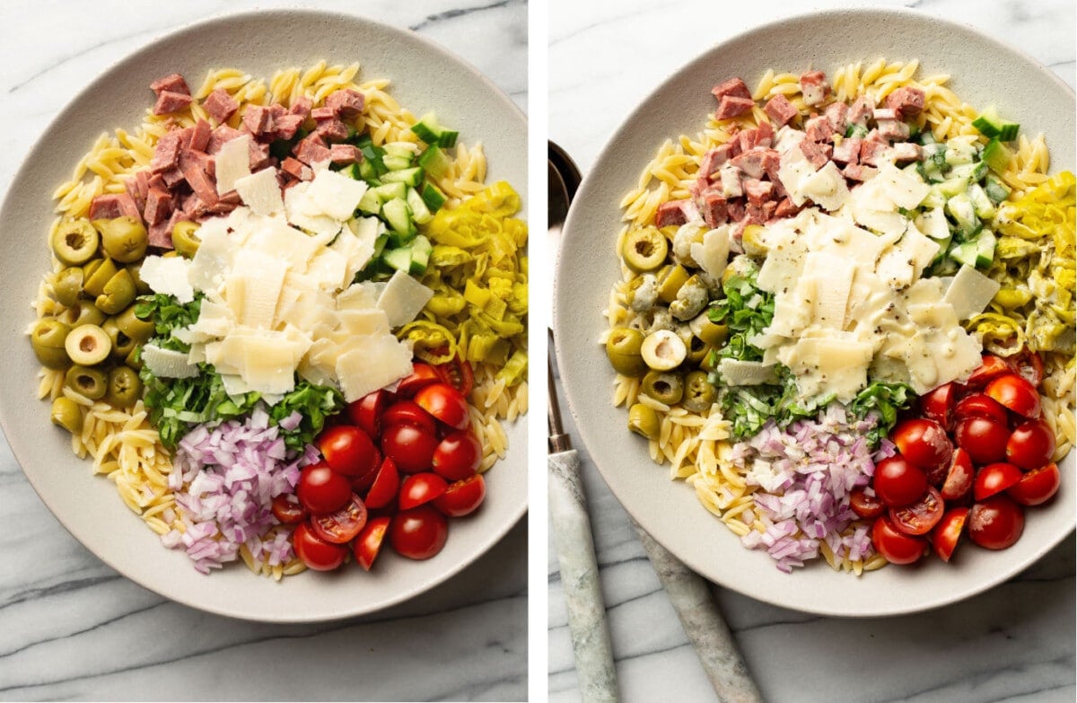 italian orzo salad on a large plate before serving next to salad utensils