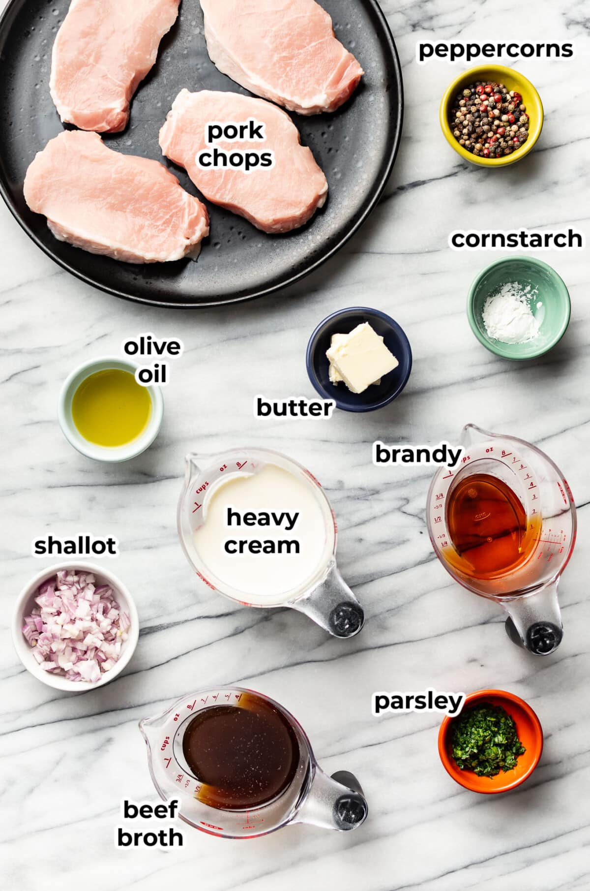 ingredients for peppercorn sauce pork chops in prep bowls