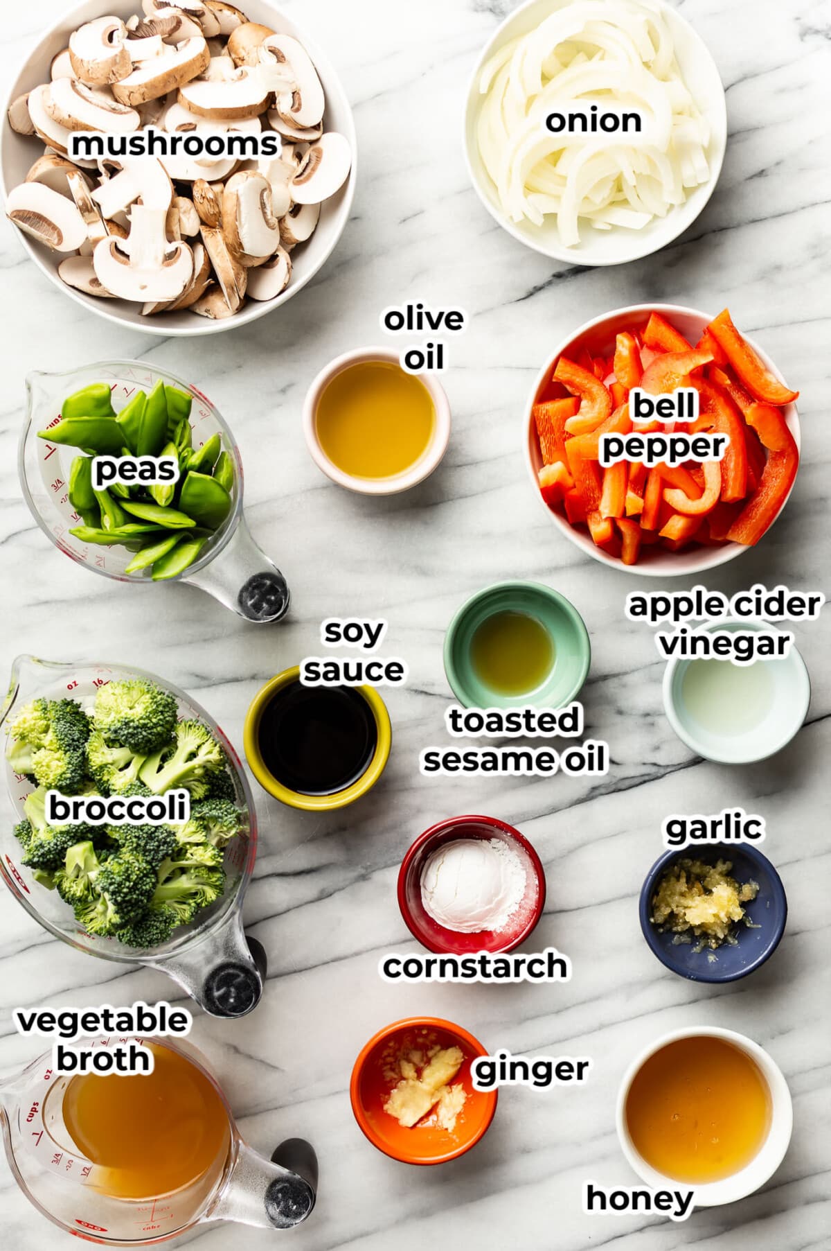 ingredients for vegetable stir fry in prep bowls