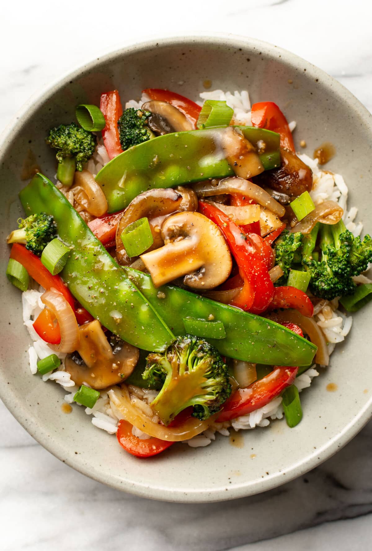 a bowl of vegetable stir fry with rice