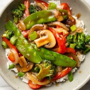 a bowl of vegetable stir fry with rice