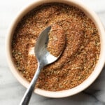 a bowl with homemade blackened seasoning and a spoon