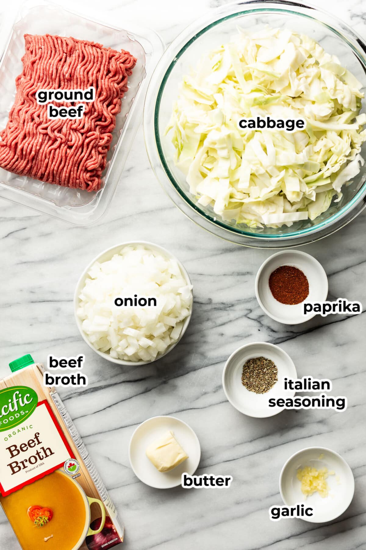 ingredients for ground beef and sauteed cabbage in prep bowls