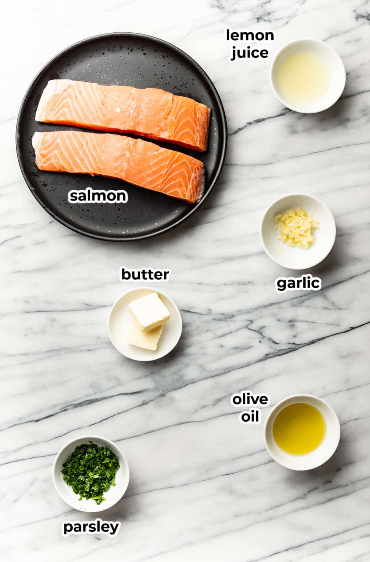 ingredients for garlic butter salmon bites in prep bowls