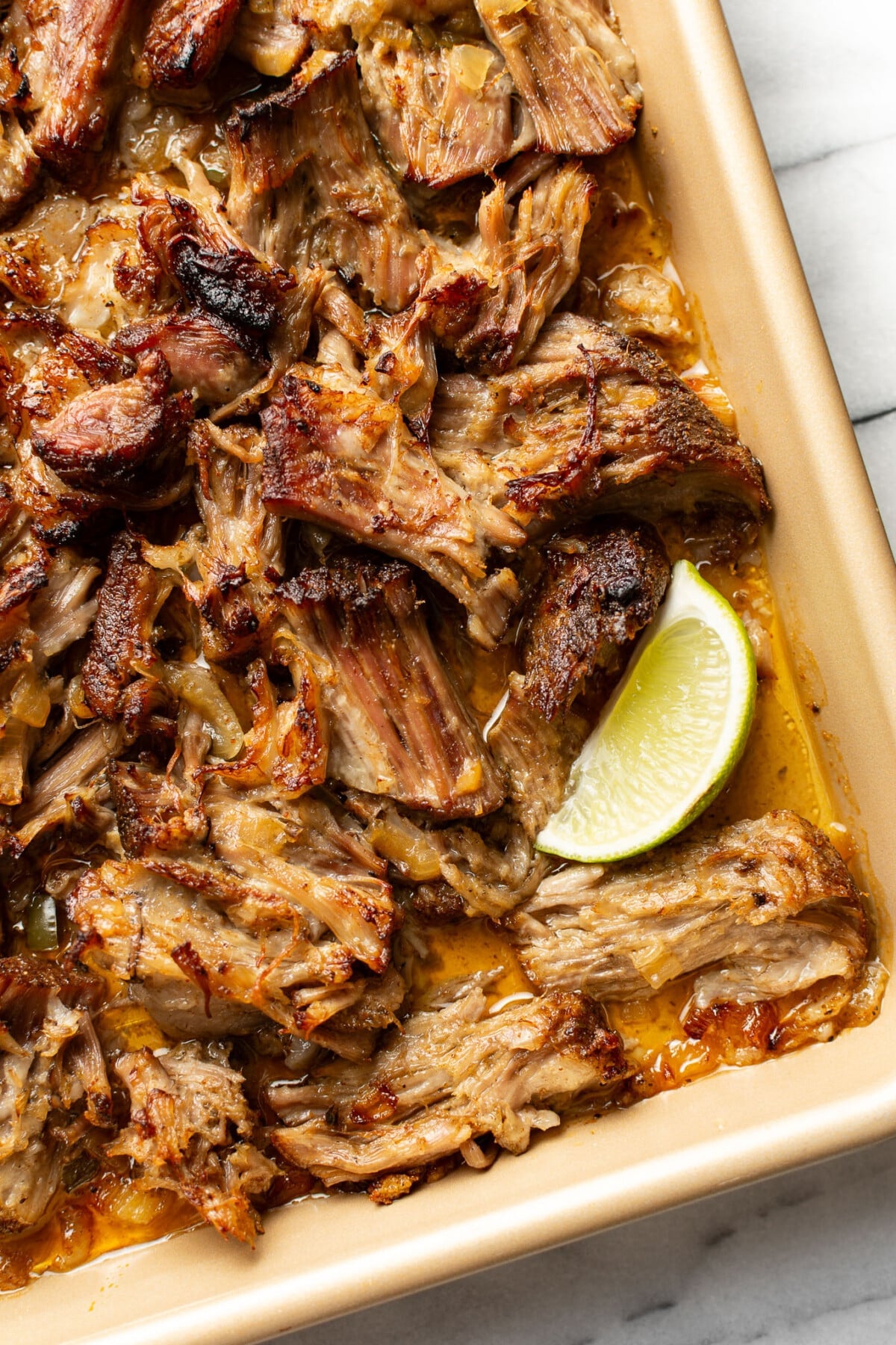 a sheet pan with shredded carnitas