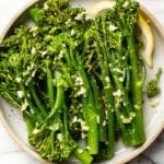 a plate with garlic butter broccolini